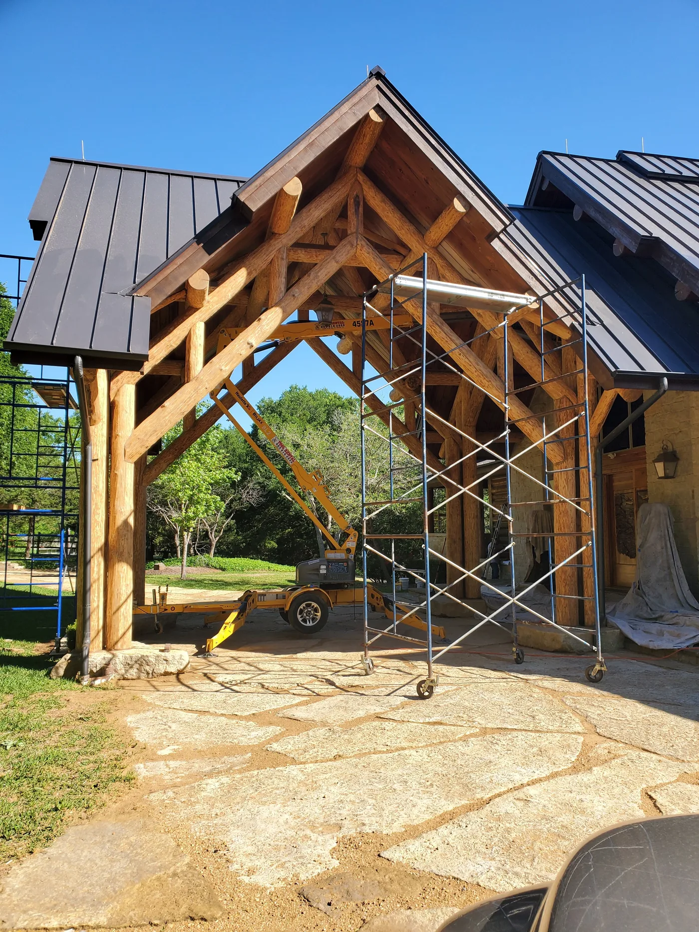Log home wall maintenance work in progress