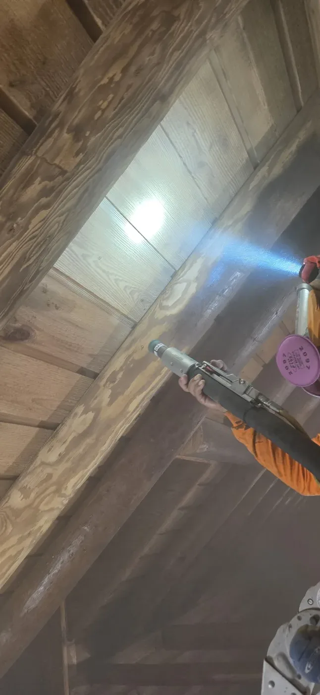 Media blasting a failed finish off Texas log home walls